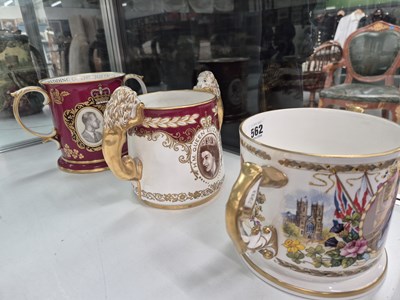 Lot 562 - Three limited edition two-handled mugs by...