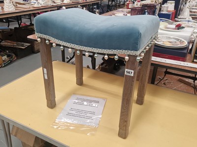 Lot 567 - A George VI limed oak coronation stool with a...