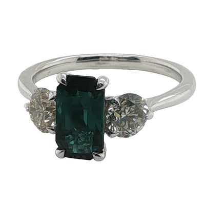 Lot 1100 - Platinum trilogy ring set with tourmaline...