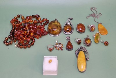 Lot 1102 - A collection of silver, amber and other...