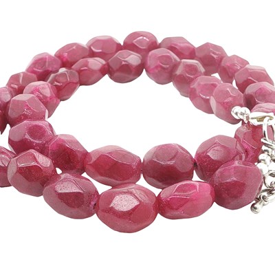 Lot 1107 - A necklace strung with large, polished...