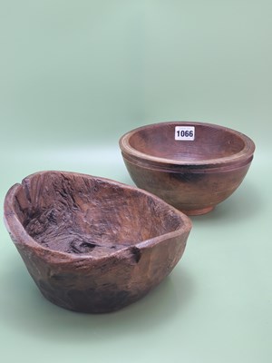 Lot 1066 - A hand hewn wooden dairy bowl together with...