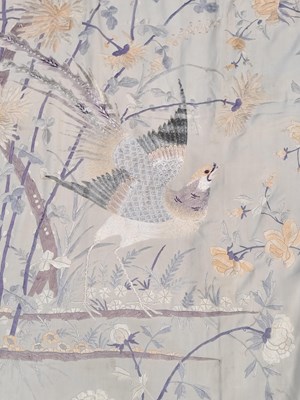 Lot 1084 - An oriental silk panel embroidered with exotic...