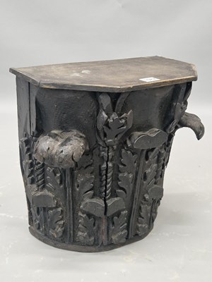 Lot 1087 - A carved and ebonised wood Corinthian capital...