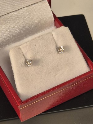 Lot 1112 - A pair of 18ct white gold 4 claw set diamond...
