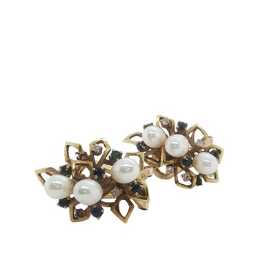 Lot 1116 - A pair of mid-century gem-set cluster earrings...