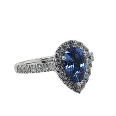 Lot 1125 - A platinum cluster ring set with a pear shaped...