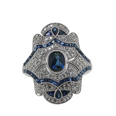 Lot 1131 - A platinum (950) ornate Art Deco style ring...