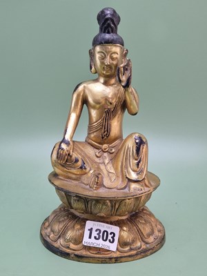 Lot 1303 - A Chinese gilt bronze figure of the Buddha...