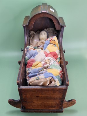 Lot 1306 - A 19th century lace dressed peg doll in a...