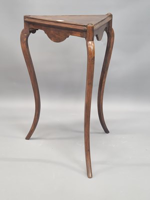 Lot 1311 - A 19th century mahogany trangular table with...