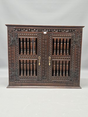 Lot 1314 - An 18th century and later oak food cupboard,...