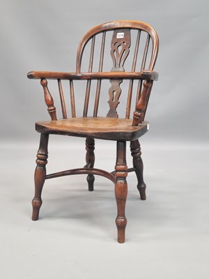 Lot 1319 - A child's Windsor chair, the oak seat above a...