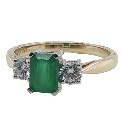 Lot 1136 - A 9ct yellow and white gold trilogy ring set...