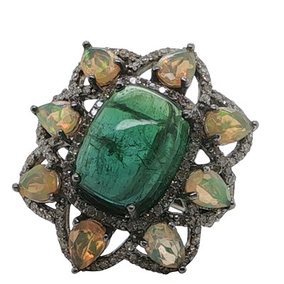 Lot 1138 - A silver dress ring set with a cabochon...