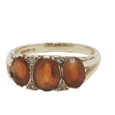 Lot 1140 - A vintage 9ct hallmarked gold three-stone...