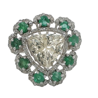 Lot 1143 - A silver dress ring set with trilliant shape...