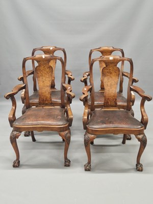 Lot 1338 - A set of four 20th century walnut elbow chairs...