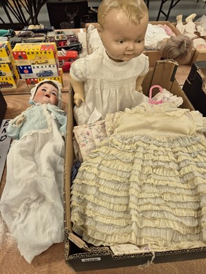 Lot 606 - Two bisque-headed dolls, another with a...