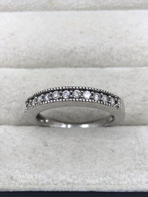 Lot 1146 - A 9ct hallmarked white gold and diamond half...
