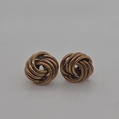 Lot 1152 - A 9ct hallmarked gold ruby and diamond three...