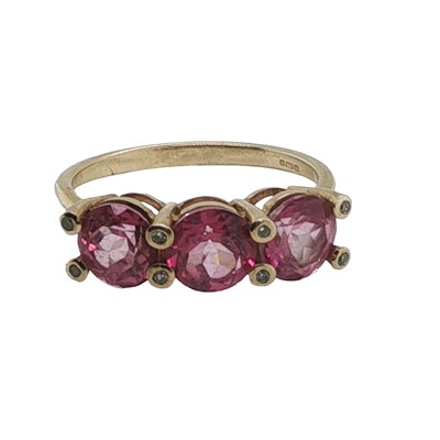 Lot 1157 - A 9ct hallmarked gold pink gemset ring with...