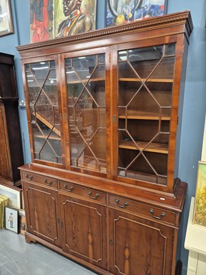 Lot 5 - A large Yew wood side cabinet/bookcase in the...