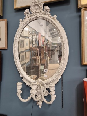 Lot 30 - An antique wall mirror with a light candle sconce