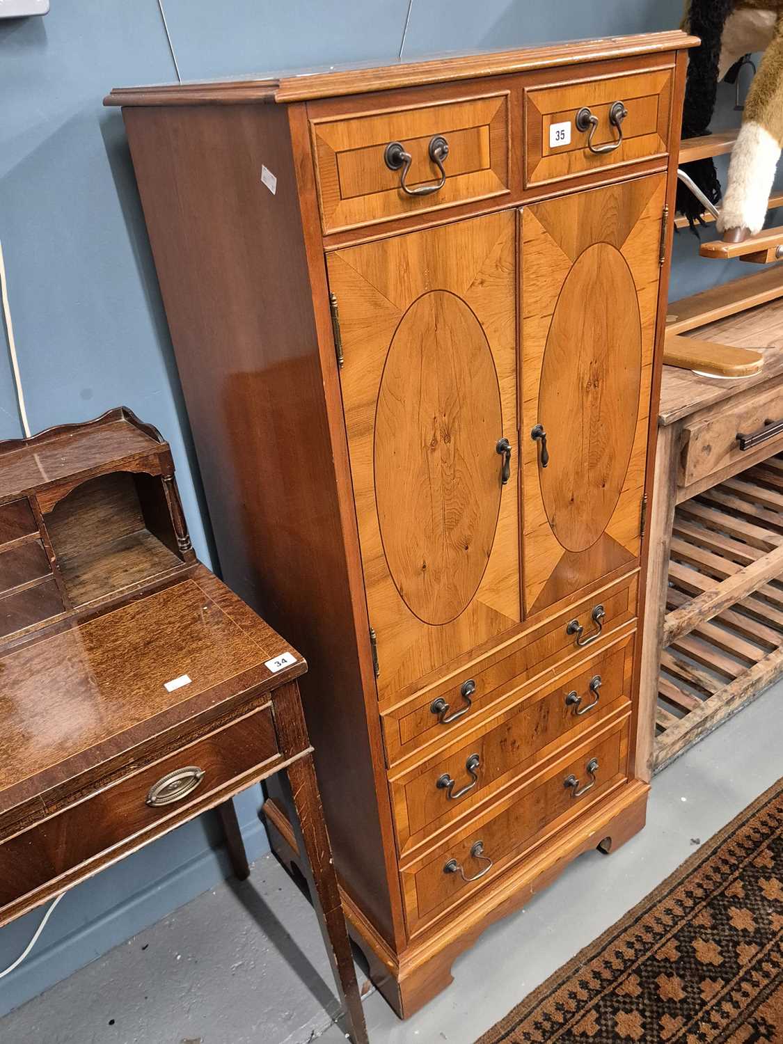 Lot 35 - A Regency-style yew wood side cabinet H 135 W...