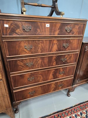 Lot 44 - A flame mahogany five-drawer chest on short...