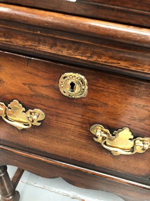 Lot 57 - A Georgian-style oak three-drawer dresser base...