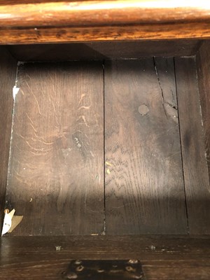 Lot 57 - A Georgian-style oak three-drawer dresser base...