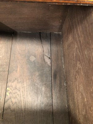 Lot 57 - A Georgian-style oak three-drawer dresser base...