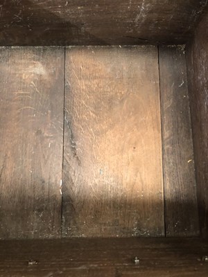 Lot 57 - A Georgian-style oak three-drawer dresser base...