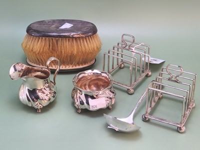 Lot 1344 - A pair of London silver five bar toast racks,...