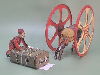 Lot 1357 - A Gescha tin plate clockwork toy bell boy on a...