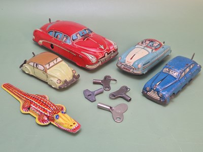 Lot 1359 - Two Huki German tinplate clockwork cars,...