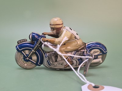 Lot 1360 - A Schuco tinplate clockwork racing motor bike toy