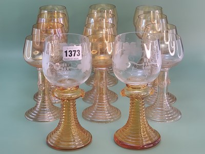 Lot 1373 - A set of twelve orange glass rummers together...