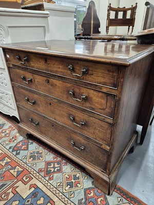 Lot 135 - A George III mahogany chest of four graduated...