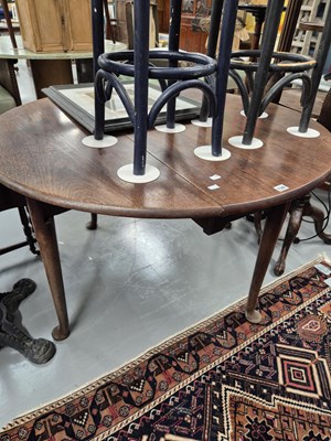 Lot 139 - A Georgian mahogany drop-leaf dining table on...