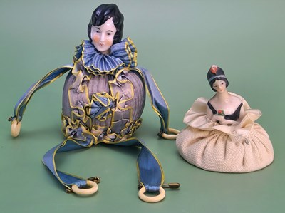 Lot 29 - A pair of porcelain half-doll sewing...
