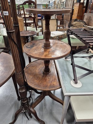 Lot 142 - An early 19th-century mahogany three-tier dumb...
