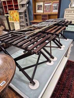 Lot 143 - Three folding luggage stands and a metal...