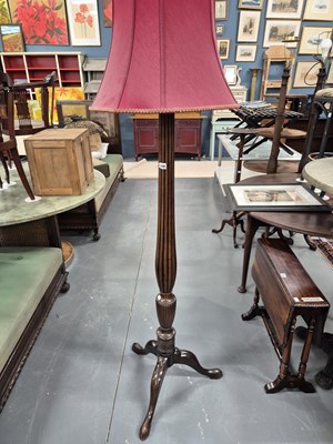 Lot 149 - A mahogany tripod based standard lamp.