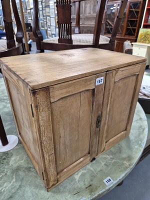 Lot 167 - A small antique pine two door cabinet H 41 W...