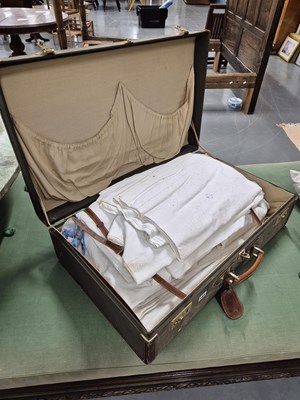 Lot 169 - A vintage suitcase containing bed linens etc.