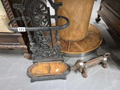 Lot 171 - A cast iron stick stand and a boot scraper