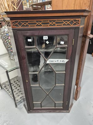 Lot 178 - A glazed corner cabinet
