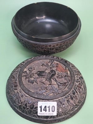 Lot 1410 - A Chinese brown lacquer bun shaped box, the...